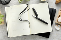 Leuchtturm1917 Medium A5 2025-2026 Weekly Planner & Notebook 18 Months - Black, Lined